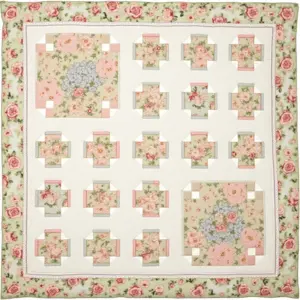 Colorful floral quilt featuring patchwork designs in a grid layout.