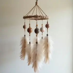 Bohemian-style dreamcatcher with feathers and decorative beads.